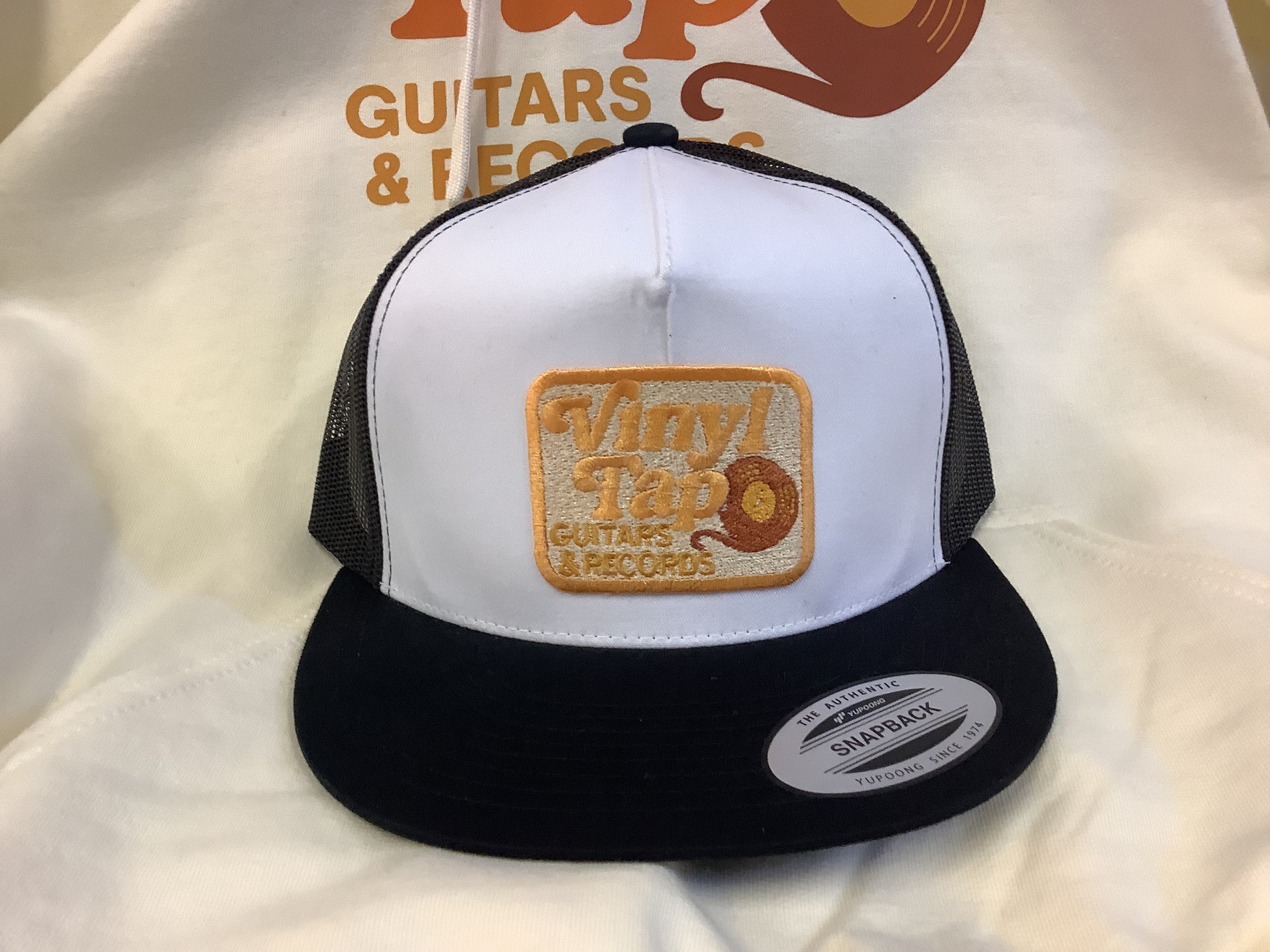 Vinyl Tap Logo Trucker Hat